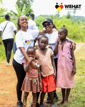 WEHAT Foundation NGO volunteers with girls from the community in eastern Uganda