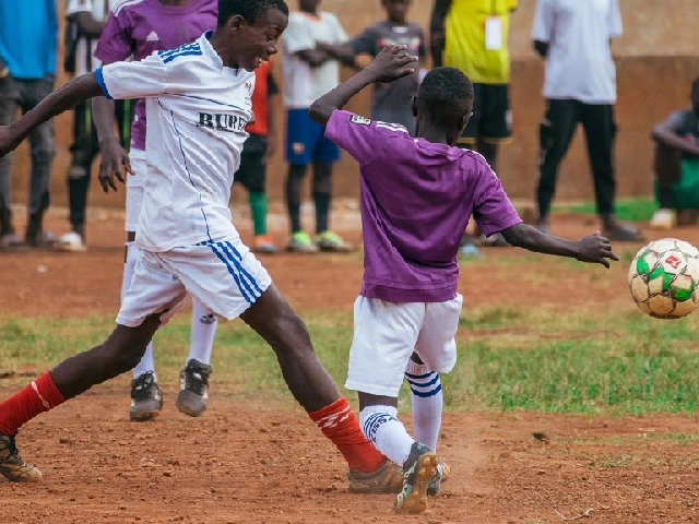 boys playing football during a wehat foundation talent development camp